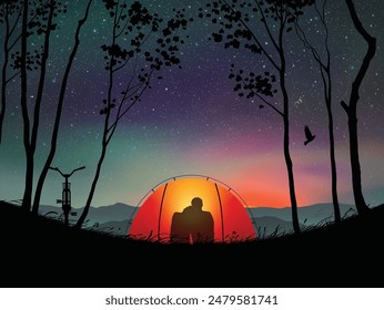Couple sit in orange tent. Camping in mountains under night starry sky