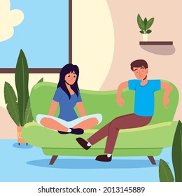 couple sits on sofa in the home