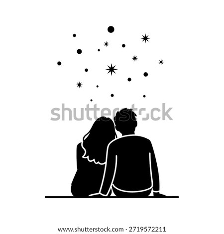 A couple sits together looking up at a starry night sky.