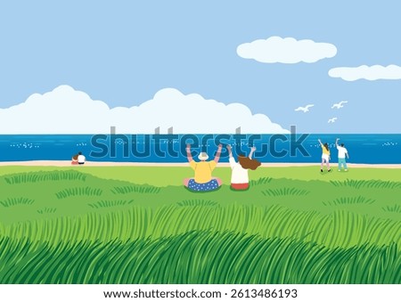 A couple sitting down on the bottom of the grass
