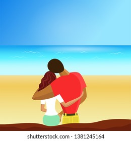 couple sitting on the beach and looking at the sea