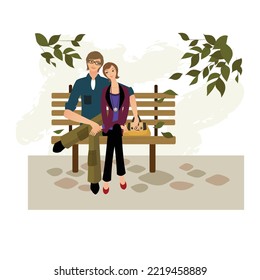 Couple sitting on bench. Loving couple on bench. Cheerful young couple sitting close to each other and smiling.