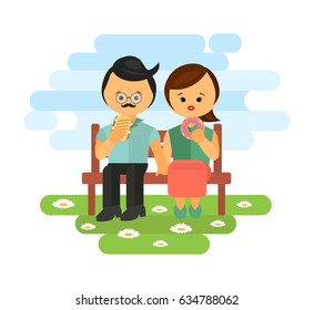 couple sitting on the bench in park and eating snacks