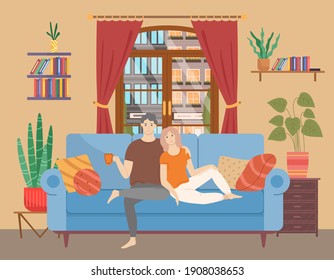 Couple sitting on sofa cuddling and and drinking tea. Man and woman together relaxing on comfortable couch in the evening. People in relationships spend time together at home. Characters sit with cup