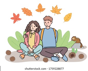 Una pareja está sentada y descansando mientras hace senderismo en otoño. ilustraciones de diseño vectorial de estilo dibujado a mano. 