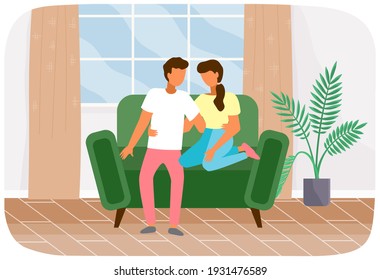 Couple sitting at sofa and talking. People in relationship relaxing at home. Happy girl and guy spending leisure time at home. Characters are communicating and hugging at couch in living room