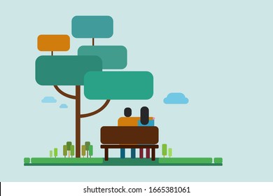 Ein Paar, das unter einem Baum im Park sitzt