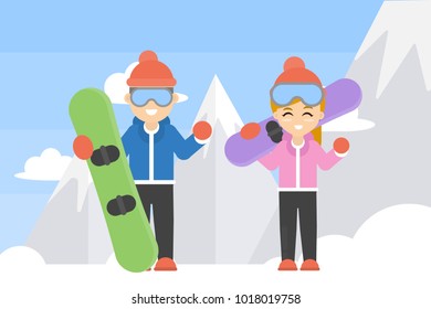 Couple with snowboards standing in the mountain.