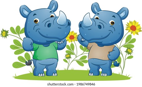 The couple of the strong rhino showing the muscle and doing sport in the garden of the illustration