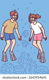Couple swims underwater wearing masks and fins, exploring coral reef and marine animals. Joyful ocean adventure during summer vacation