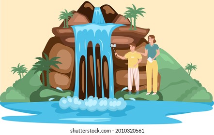 Couple take selfie stand near lake in mountaines landscape with waterfall. Traveler photographing famous landmark in beautiful island in summer vacation. Tourist attraction of wonderful place of visit