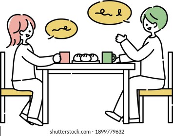 A couple talking at a dining table