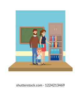 couple teachers with boy in the classroom