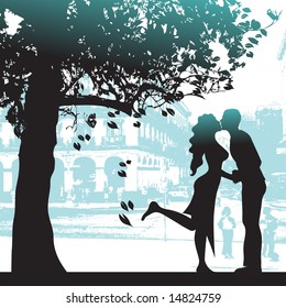 Couple under the tree in city park