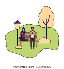 couple using mobiles in the park