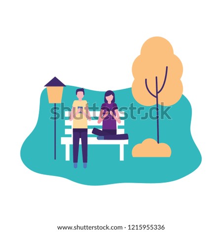 couple using mobiles in the park