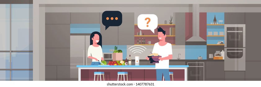 couple using smart speaker, man woman preparing food  