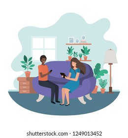 couple using technology devices in livingroom