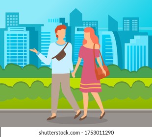 Couple walking in a park. Young guy and girl holding hands walking in summer city alley, romantic walk. Lovers man and woman met on a date outdoor. Romantic promenade in the open air cityscape