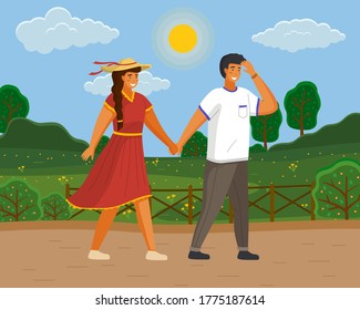 Pareja caminando en un parque. Muchacho y muchacha usando un vestido ligero y un sombrero de paja sosteniendo manos caminando en el jardín de verano, caminata romántica. Un hombre y una mujer amigos se reunieron en un día soleado al aire libre,