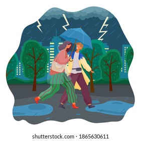 Couple walking in the rain with umbrella and wearing raincoats in the city park, thunder and lightning in the sky. Man and woman spend time together on a rainy day, running through the puddles