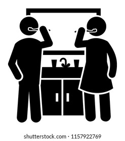 
A couple  in a wash basin are brushing teeth at the start of the day
