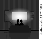 Couple watching movie on TV at night