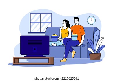 A couple watching tv in the living room