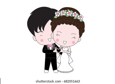 couple in wedding dress and make Heart-shaped hand sign