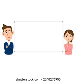 Pareja preocupada mientras mira la pizarra
