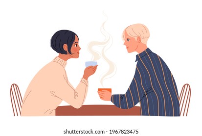 Couple of young people sitting in a cafe with coffee