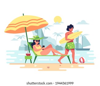 Couples invites each other to a vacation on the beach. The windy waves are perfect for surfing. Good atmosphere, suitable for sunbathing. Young woman use a cell phone in bed under a large umbrella. 