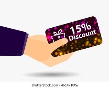Coupon for a 15-percent discount in the hand. Gift card with bright sparks. Vector illustration.