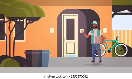 courier man delivering cardboard parcel ringing house doorbell express delivery service concept horizontal full length flat vector illustration