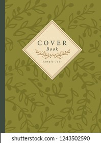 Cover book decorated with hand-drawn olive branches pattern and label with sample text and handmade text divider.