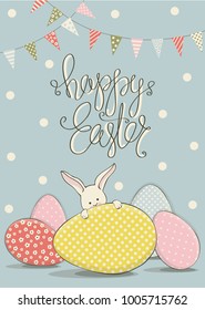 Cover for greeting cards to day happy Easter.Shown Easter eggs in different colors and with different ornaments,Easter Bunny,garland and colored flags. The phrase happy Easter on a blue background.