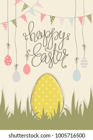 Cover for greeting cards to day happy Easter.Shown Easter eggs of different colors and ornaments,garland and flags.The phrase happy Easter.Big yellow egg on the green grass.
