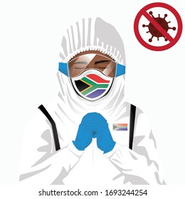 Covid-19 or Coronavirus concept. African medical staff wearing mask in protective clothing and praying for against Covid-19 virus outbreak in South Africa. African man and South Africa flag. Pandemic