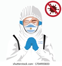 Covid-19 or Coronavirus concept. Argentinian medical staff wearing mask in protective clothing and praying for against Covid-19 virus outbreak in Argentina. Argentinian man, Argentina flag. Pandemic