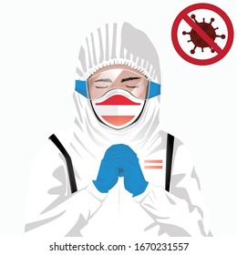 Covid-19 or Coronavirus concept. Austrian medical staff wearing mask in protective clothing and praying for against Covid-19 virus outbreak in Austria. Austrian man and Austria flag. Epidemic corona
