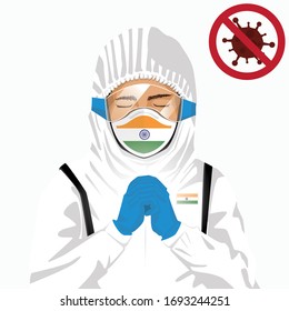 Covid-19 or Coronavirus concept. Indian medical staff wearing mask in protective clothing and praying for against Covid-19 virus outbreak in India. Indian man and India flag. Pandemic corona virus