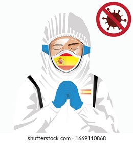 Covid-19 or Coronavirus concept. Spanish medical staff wearing mask in protective clothing and praying for against Covid-19 virus outbreak in Spain. Spanish man and Spain flag. Epidemic corona virus