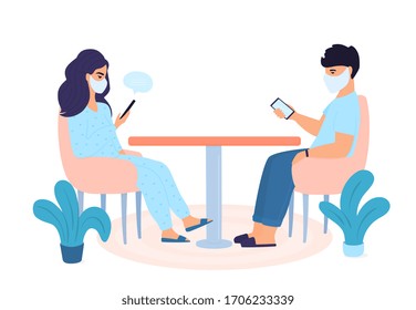 COVID-19. Family quarantined. Self isolation. Coronavirus pandemic. The concept of stay home. Man is using gadgets. Woman is chatting online on smartphone.