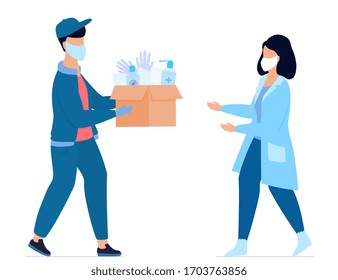 COVID-19. Humanitarian aid. Supply of medical protective masks, gloves and disinfectants. Coronavirus epidemic. Volunteer gives a parcel to a nurse