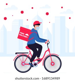 COVID-19. Quarantine in the city. Coronavirus epidemic. Delivery man in a protective mask carries food on a bicycle. Free shipping
