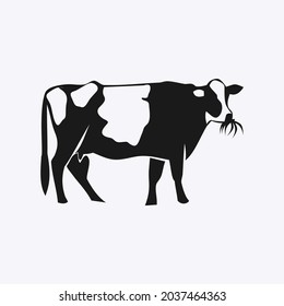 Cow eating grass black silhouette vector