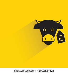 cow and identification tag with shadow on yellow background