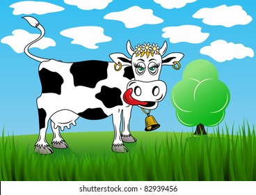 Cow on a background of green grass and the sky