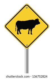 Cow on yellow traffic sign