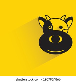 cow with shadow on yellow background